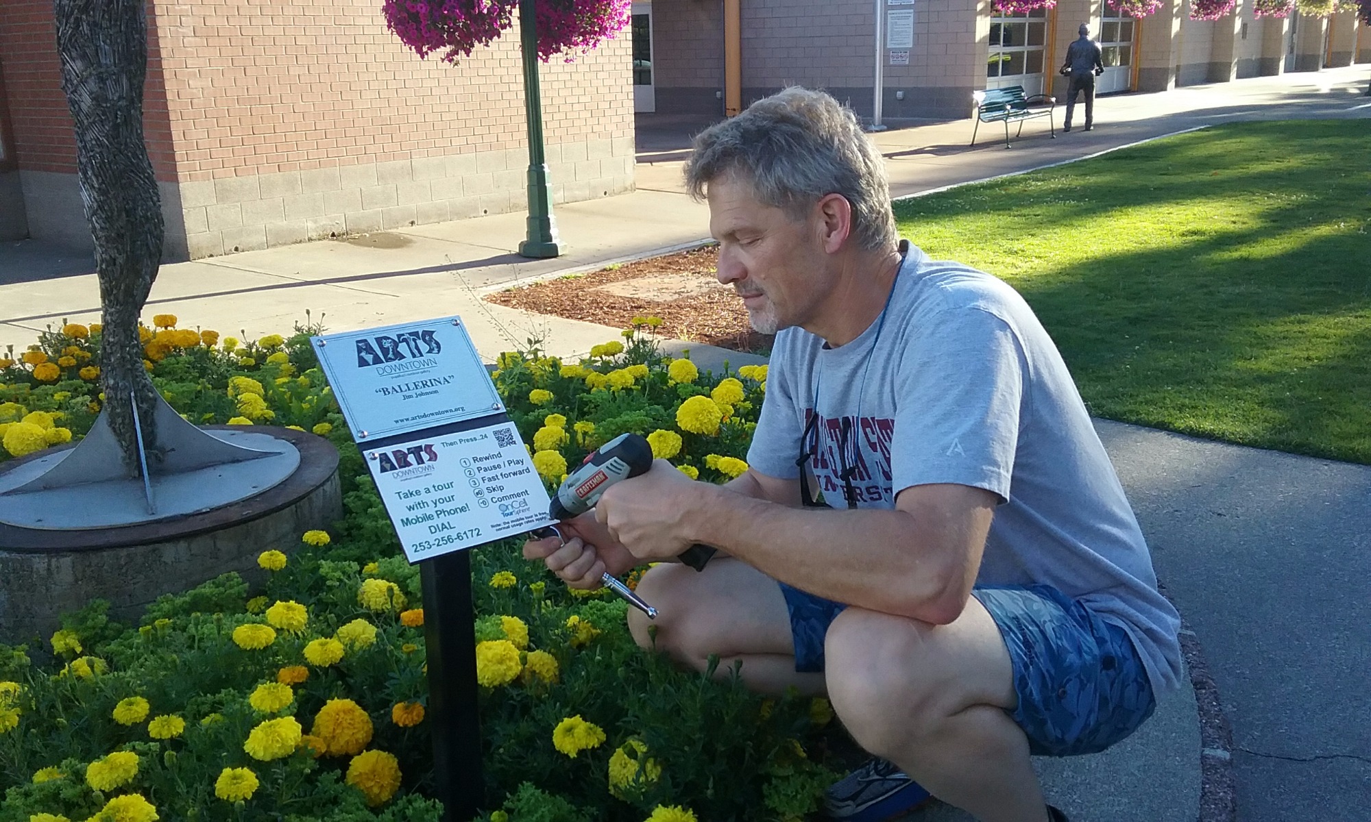 NEW PHONE TOUR SIGN HOLDERS BEING INSTALLED